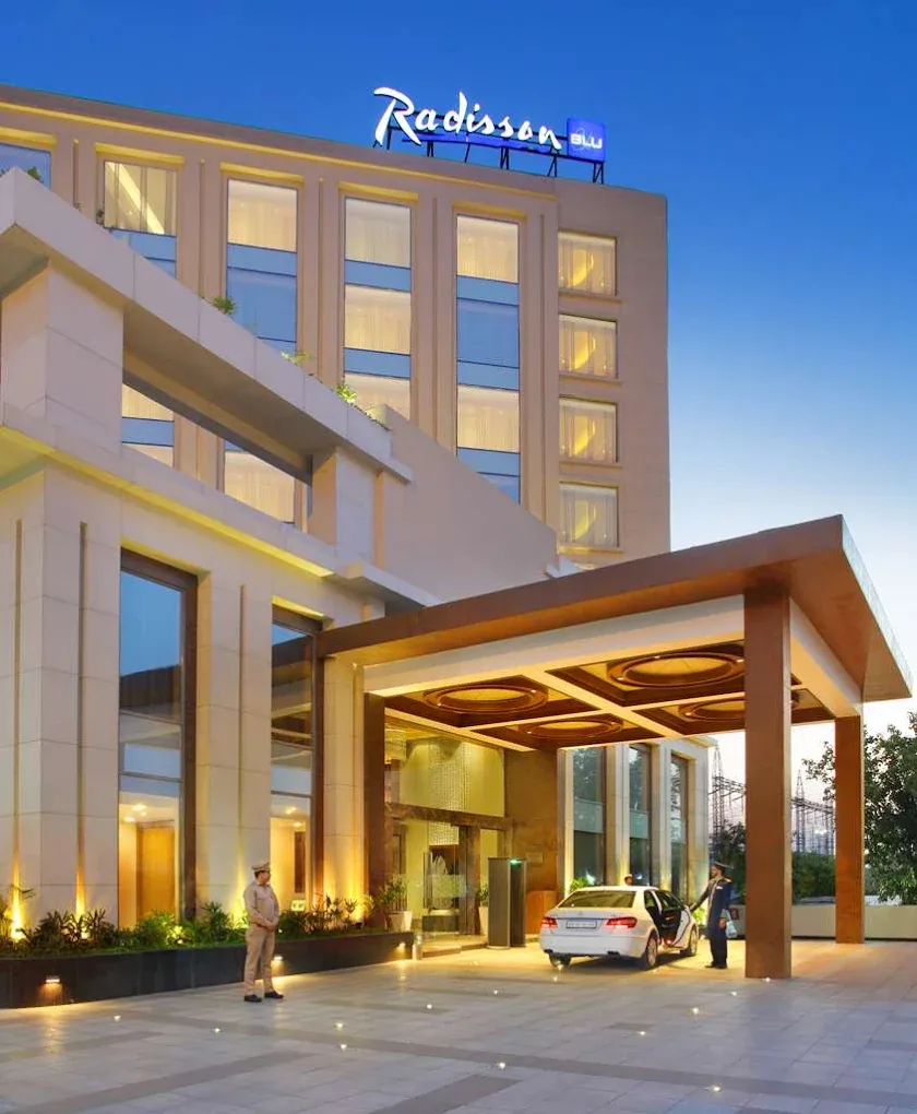 Radisson Blu Jammu — hotel entrance and porte-cochère at dusk
